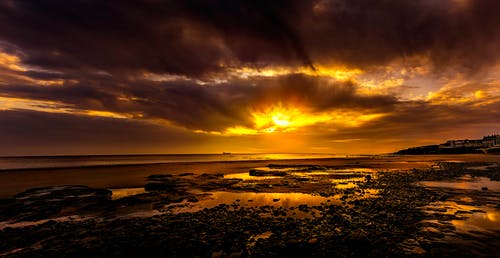 日落期间的海滨 · 免费素材图片